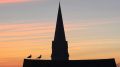 Sunset view over Swindon showing one of the town’s historic church spires